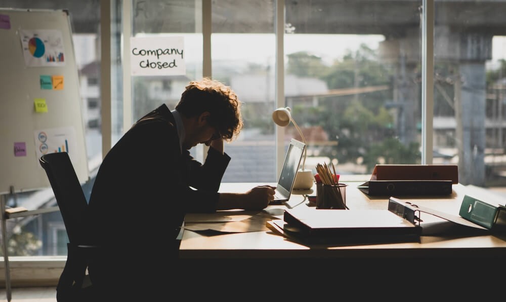 Businessman stressed with company closed